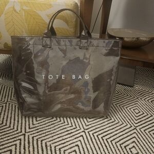 The Tote Bag.  NWOT. Never Carried.